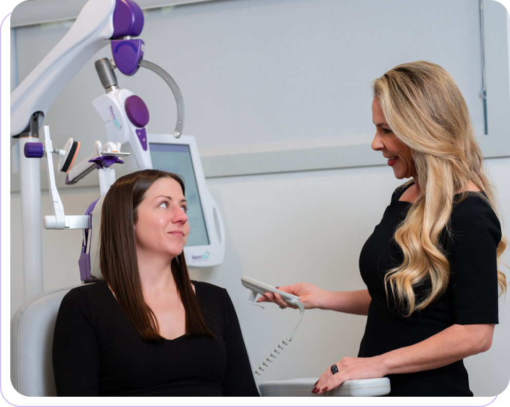 Clinician explaining NeuroStar TMS to a patient